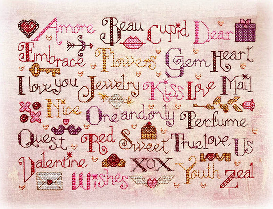 A Valentine ABC machine embroidered mug rug in the cross stitch technique